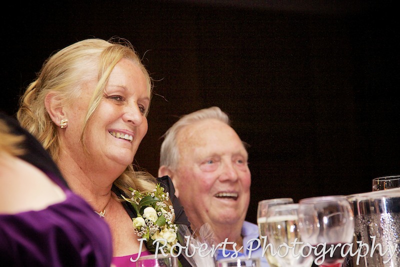 Mother of groom and grandfather enjoying wedding speeches - wedding photography sydney